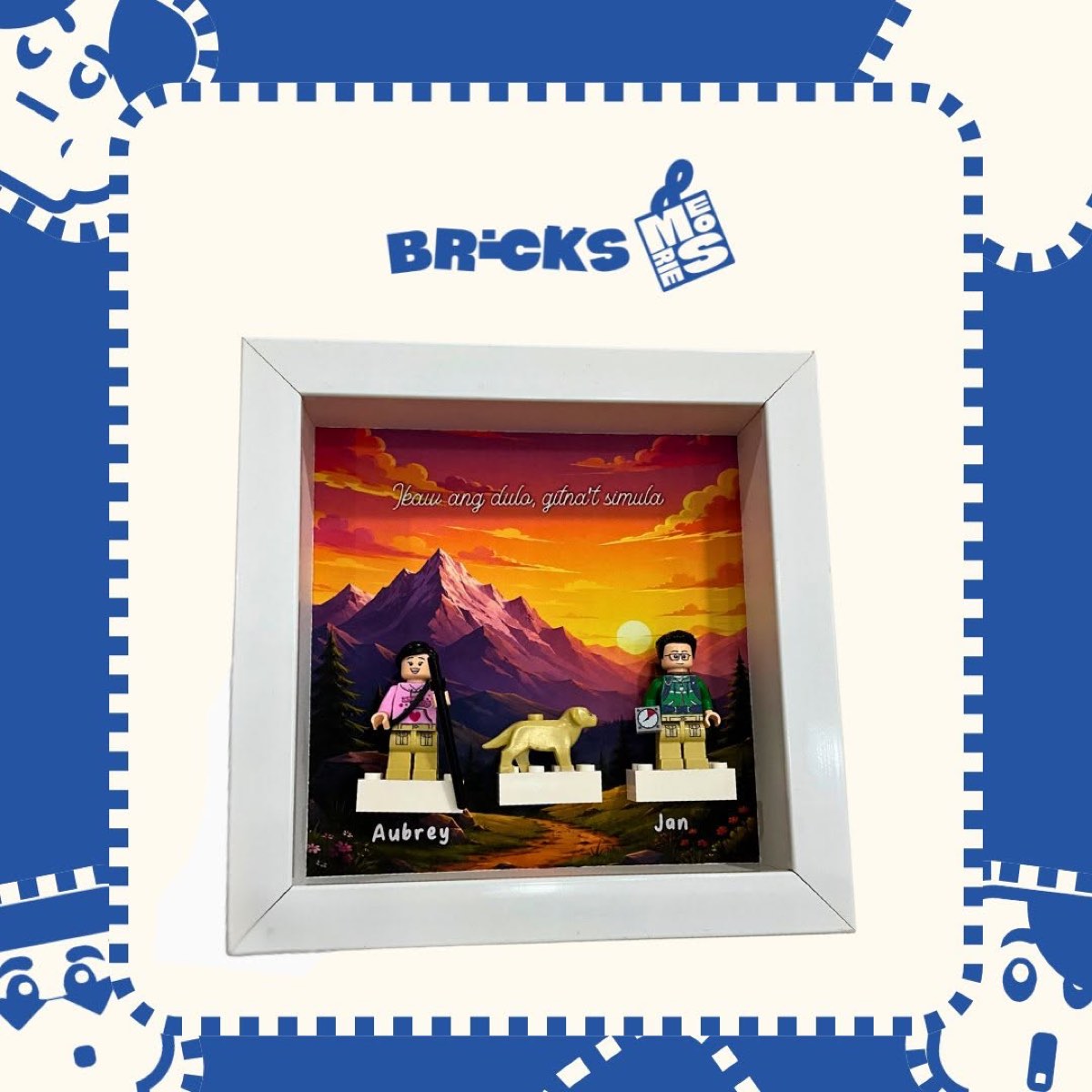 A custom minifigure diorama scene with a mountain sunset backdrop